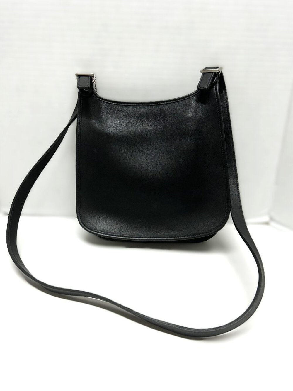 flat black leather bohemian style saddle crossbody bag by COACH